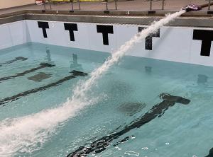  Pool being filled with water from hose